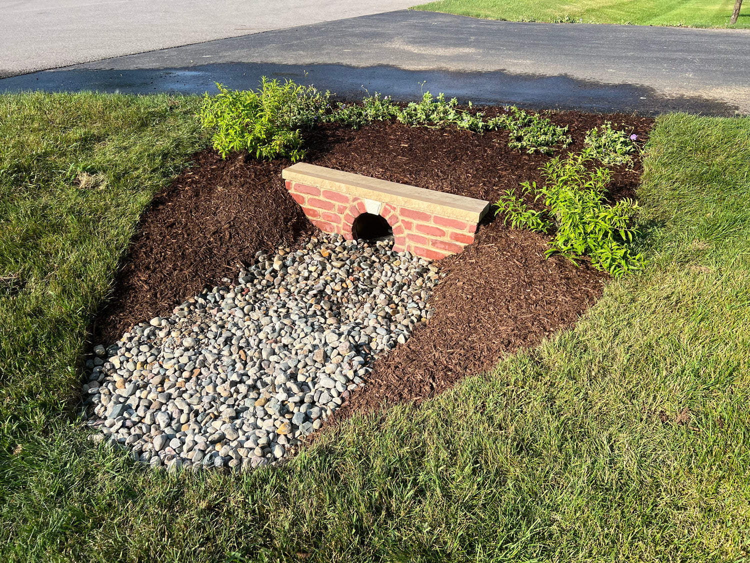 Prefabricated GFRC concrete raised garden bed installed in a residential backyard — Homebridge Precast Brickyard finish