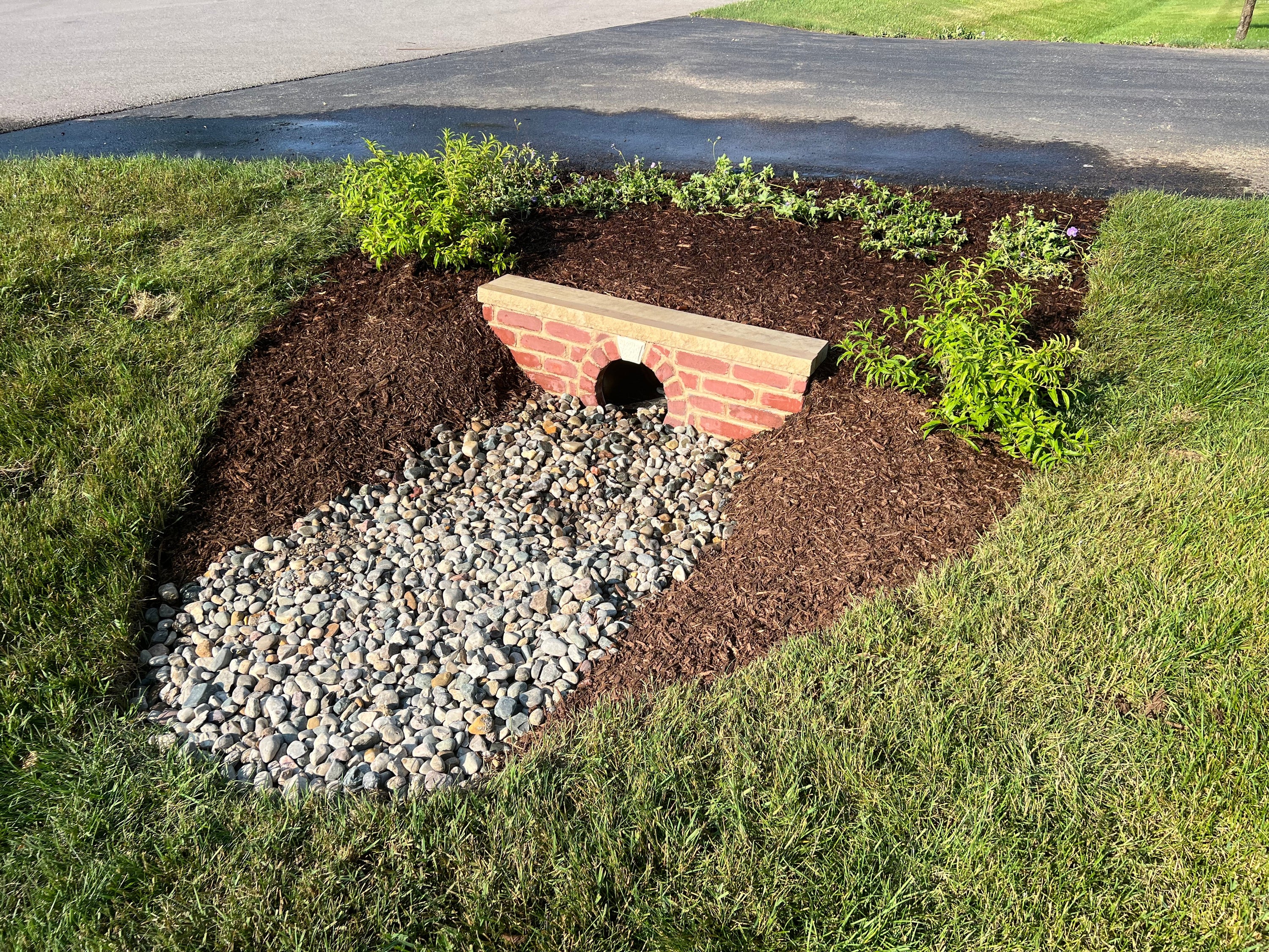 Prefabricated GFRC concrete raised garden bed installed in a residential backyard — Homebridge Precast Brickyard finish